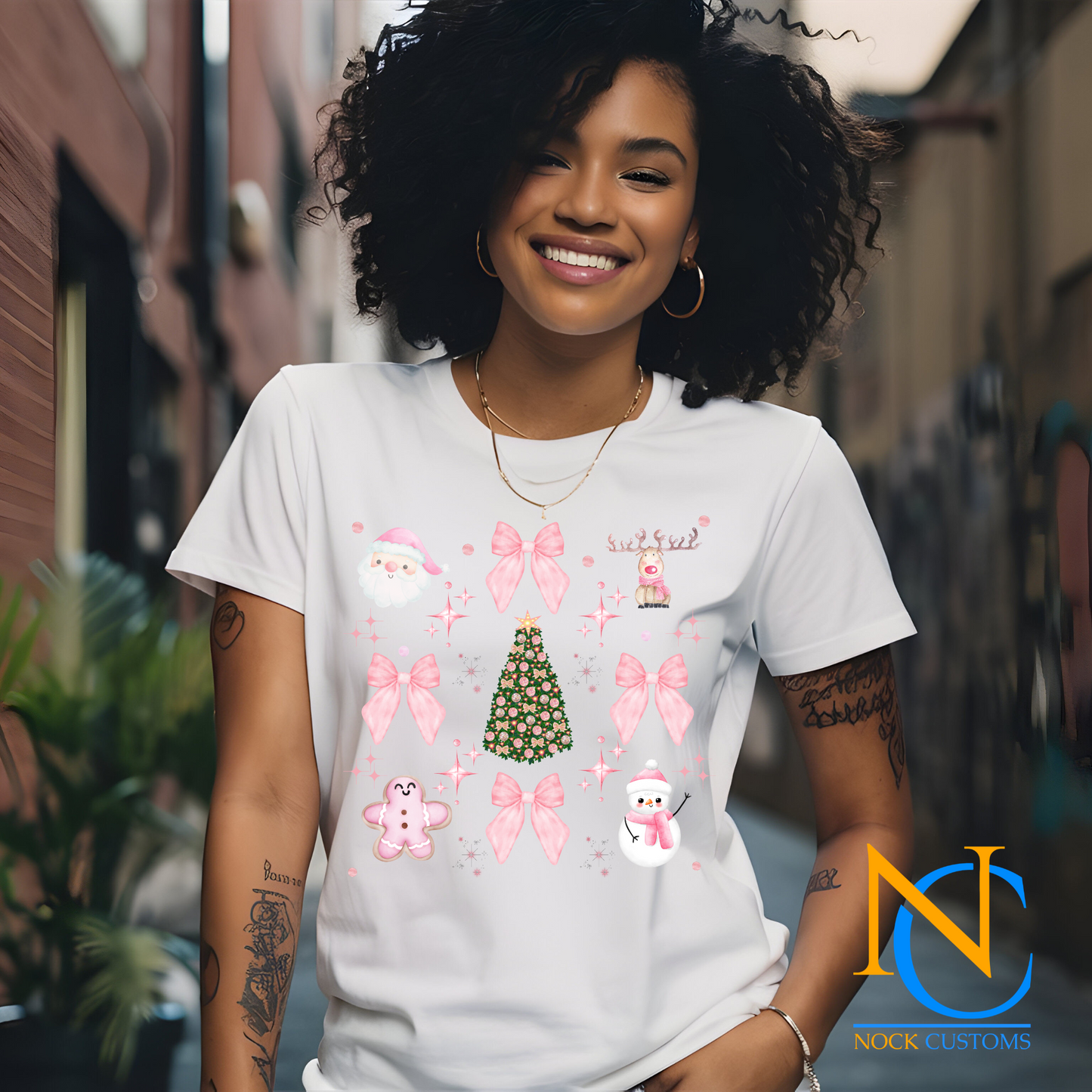Festive pink-themed Christmas DTF transfer with bows, snowmen, gingerbread, and holiday tree designs for apparel decoration.