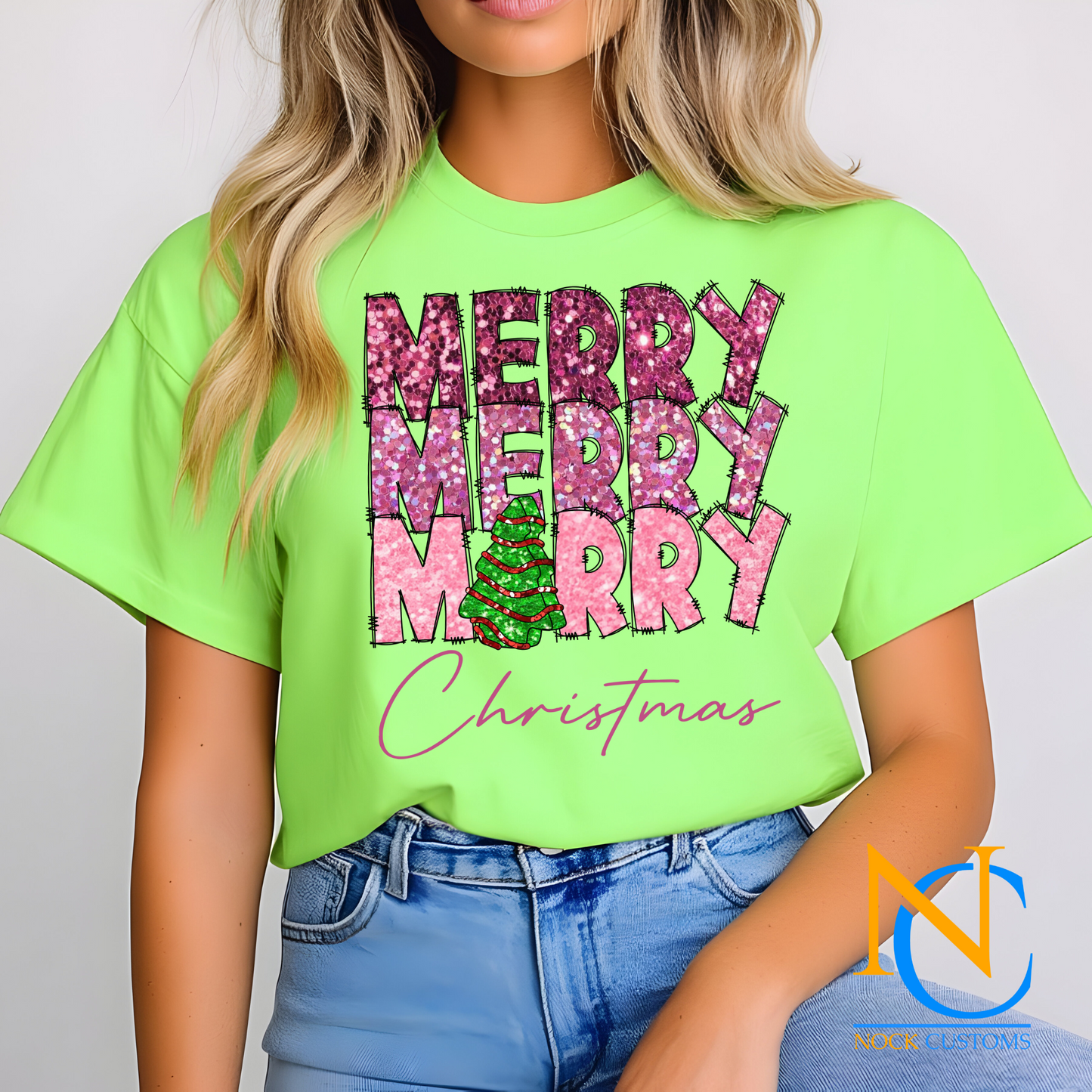 DTF transfer featuring the text 'Merry Merry Merry Christmas' in pink glitter with a green Christmas tree detail.