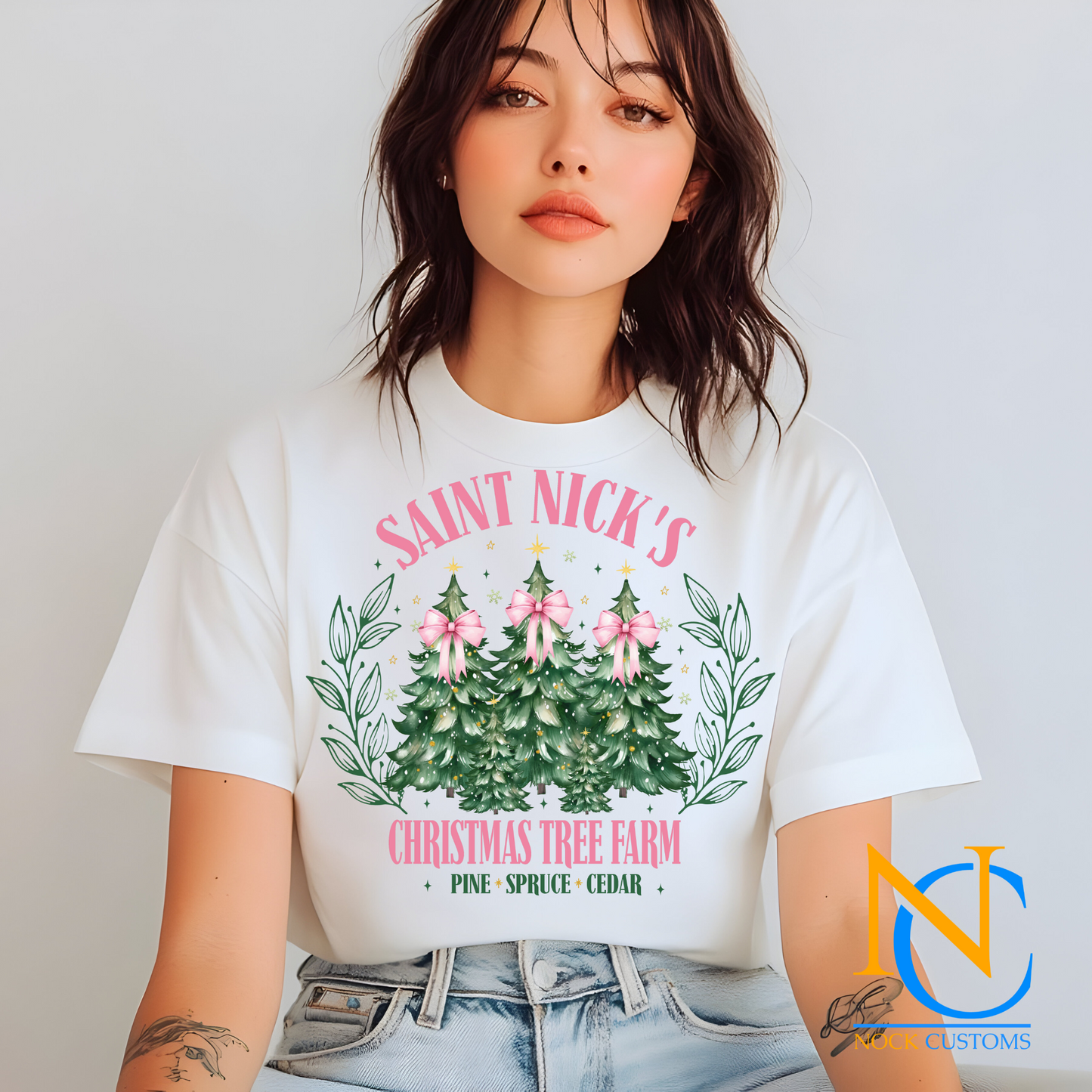 A holiday-themed DTF transfer design featuring Saint Nick’s Christmas Tree Farm with three festive Christmas trees adorned with pink bows and surrounded by leafy accents, perfect for custom apparel.