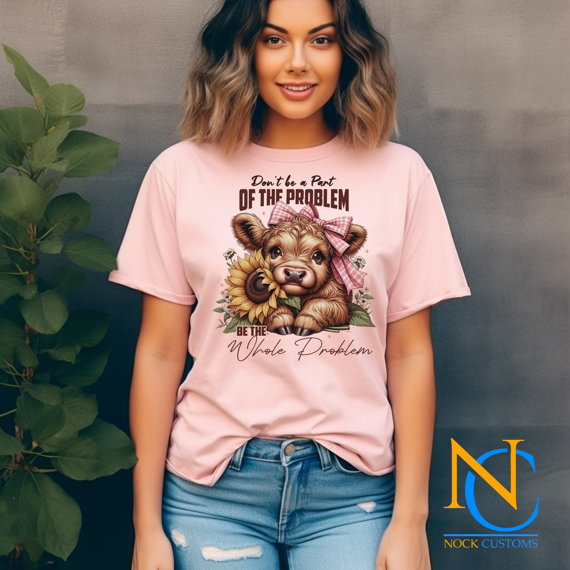 An adorable design featuring a baby cow with a pink gingham bow, holding a vibrant sunflower, surrounded by floral accents and the text 'Don't Be a Part of the Problem, Be the Whole Problem.' Perfect for direct-to-film (DTF) transfers with a playful and charming vibe.