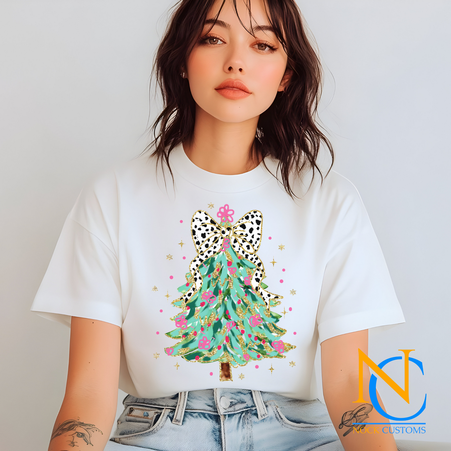 Stylish DTF transfer design featuring a vibrant Christmas tree with a leopard-patterned bow, perfect for holiday-themed DIY apparel.