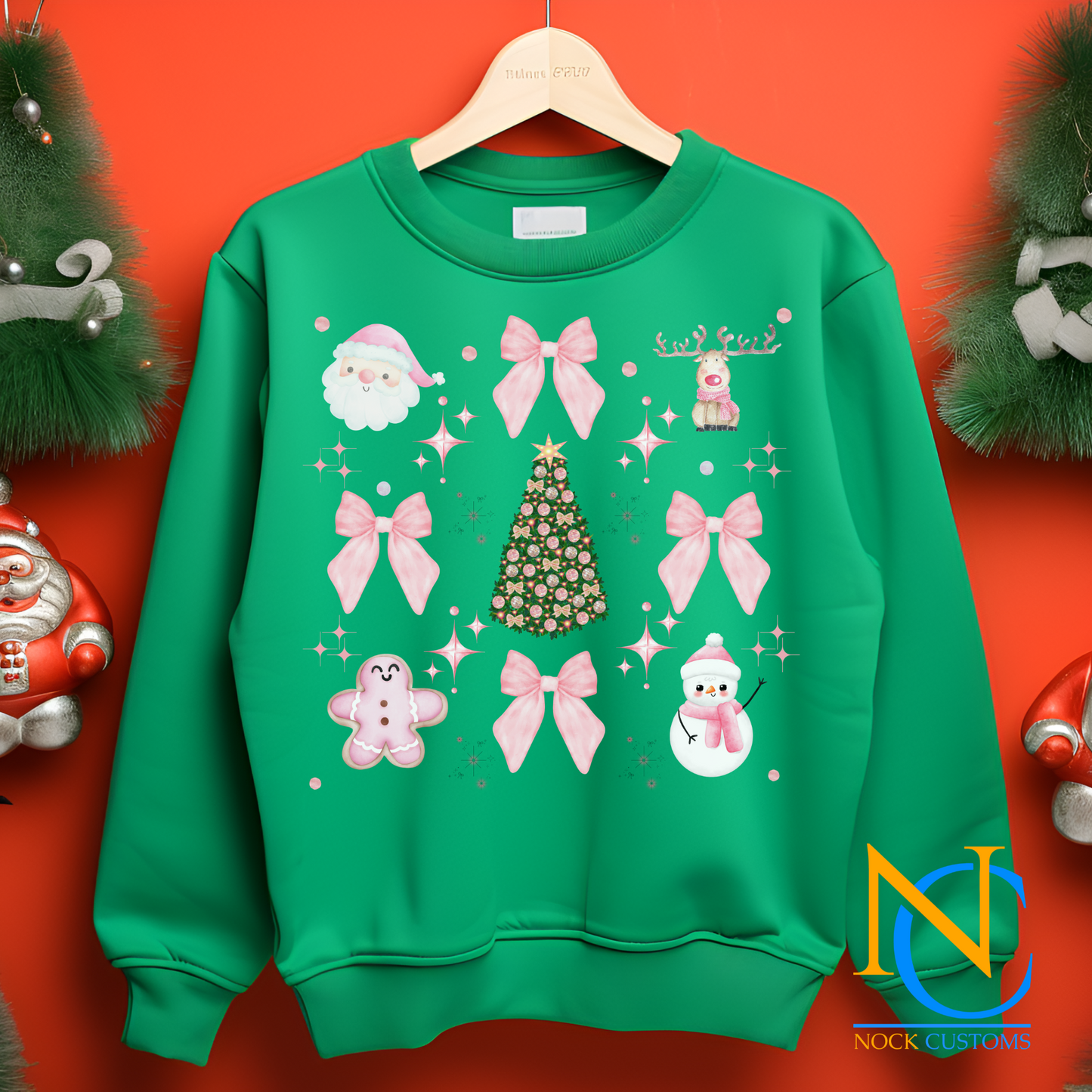 Festive pink-themed Christmas DTF transfer with bows, snowmen, gingerbread, and holiday tree designs for apparel decoration.