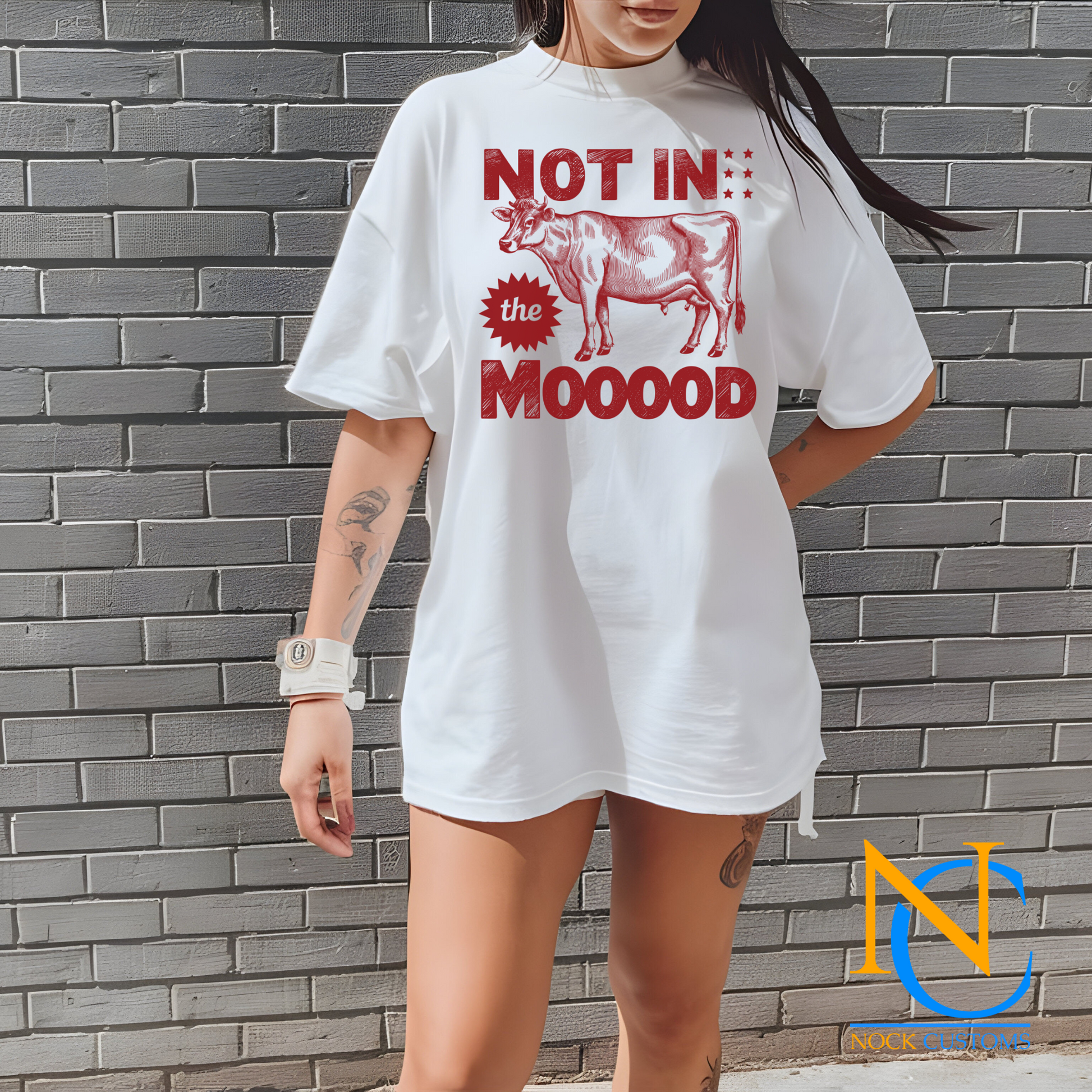 A humorous design featuring a red silhouette of a cow with bold text reading 'Not in the Mooood,' accented by star details. Perfect for direct-to-film (DTF) transfers with a playful and sarcastic vibe.