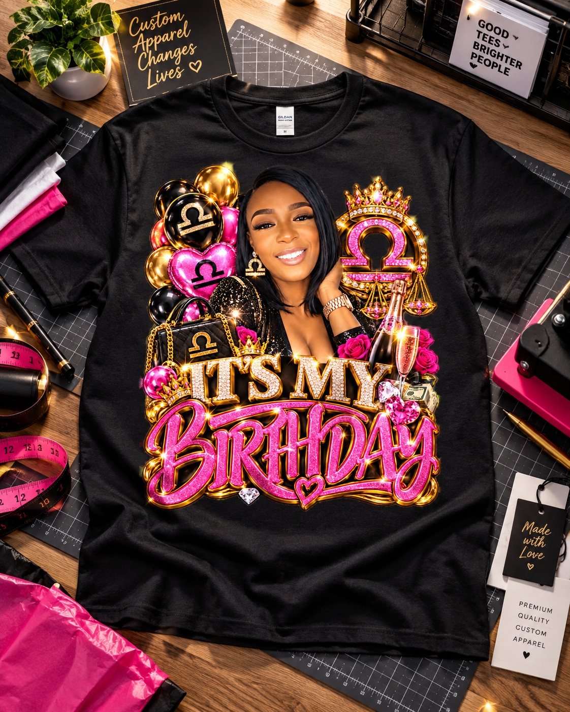 Black Libra birthday T-shirt laid flat with portrait artwork, crowned scales, and hot pink “It’s My Birthday” lettering.