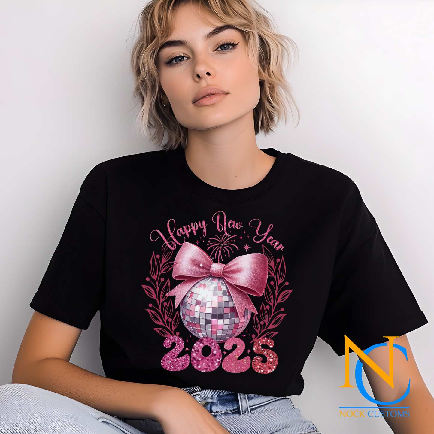 DTF transfer print design featuring 'Happy New Year 2025' with a pink disco ball and bow on a T-shirt.