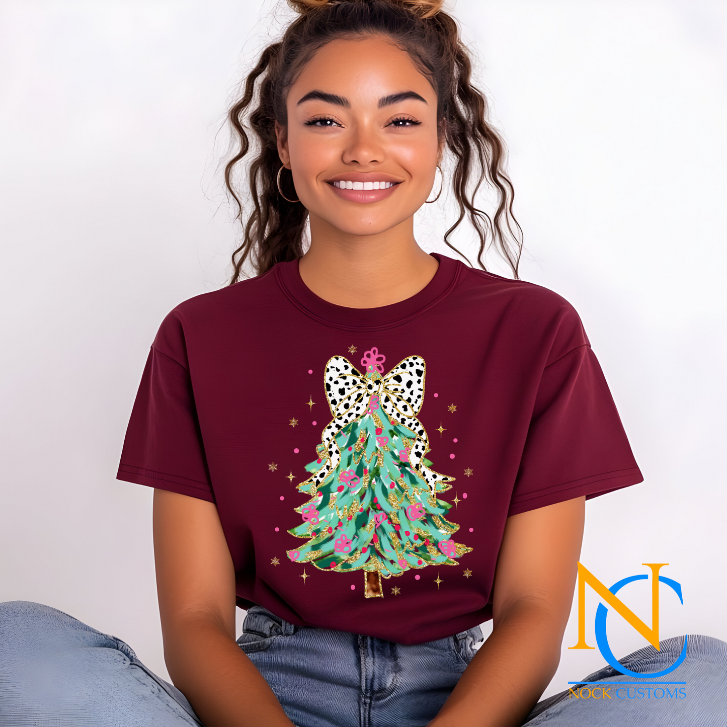 Stylish DTF transfer design featuring a vibrant Christmas tree with a leopard-patterned bow, perfect for holiday-themed DIY apparel.