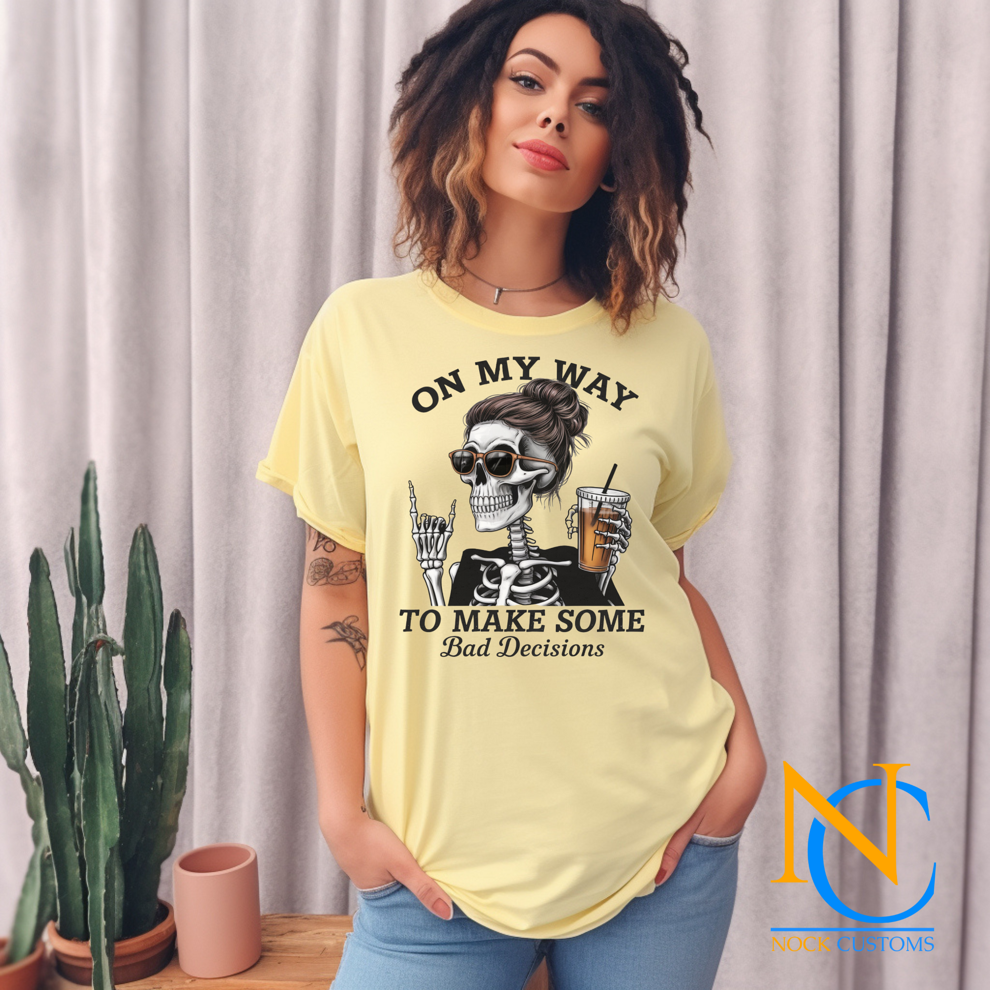 A fun and edgy design featuring a skeleton with a messy bun and sunglasses, holding an iced coffee, accompanied by the text 'On My Way to Make Some Bad Decisions.' Perfect for direct-to-film (DTF) transfers with a humorous and sassy vibe.