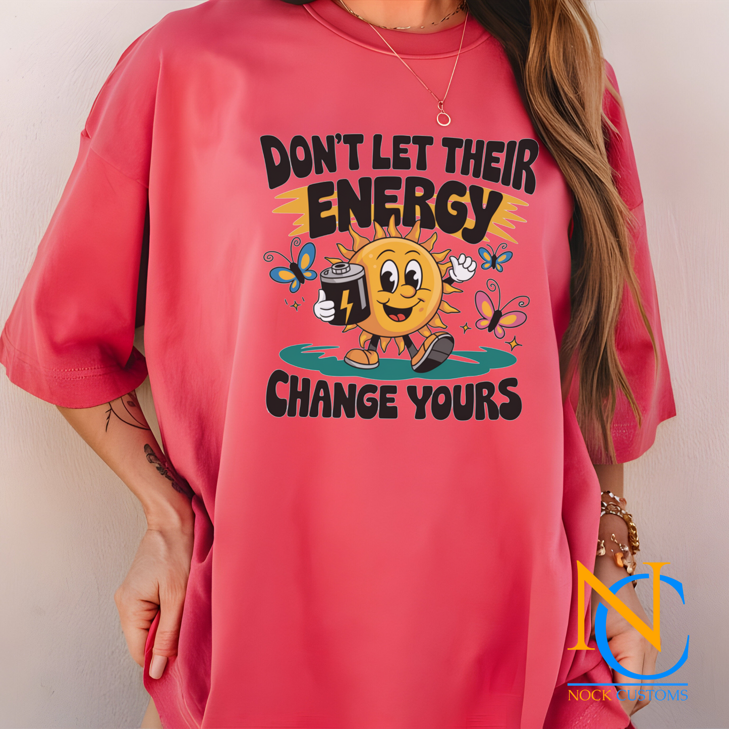 A cheerful design featuring a smiling sun holding a battery, surrounded by colorful butterflies and the text 'Don't Let Their Energy Change Yours.' Perfect for direct-to-film (DTF) transfers with a motivational and uplifting vibe.