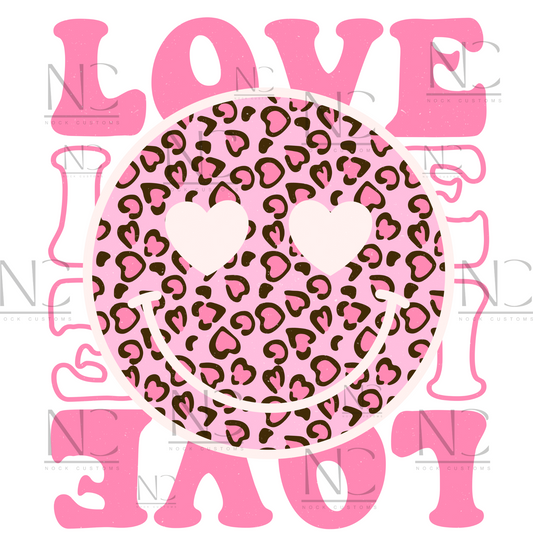 A vibrant pink design featuring a leopard print smiley face with heart eyes, surrounded by the word 'LOVE' in bold pink letters. Perfect for direct-to-film (DTF) transfers on various materials.