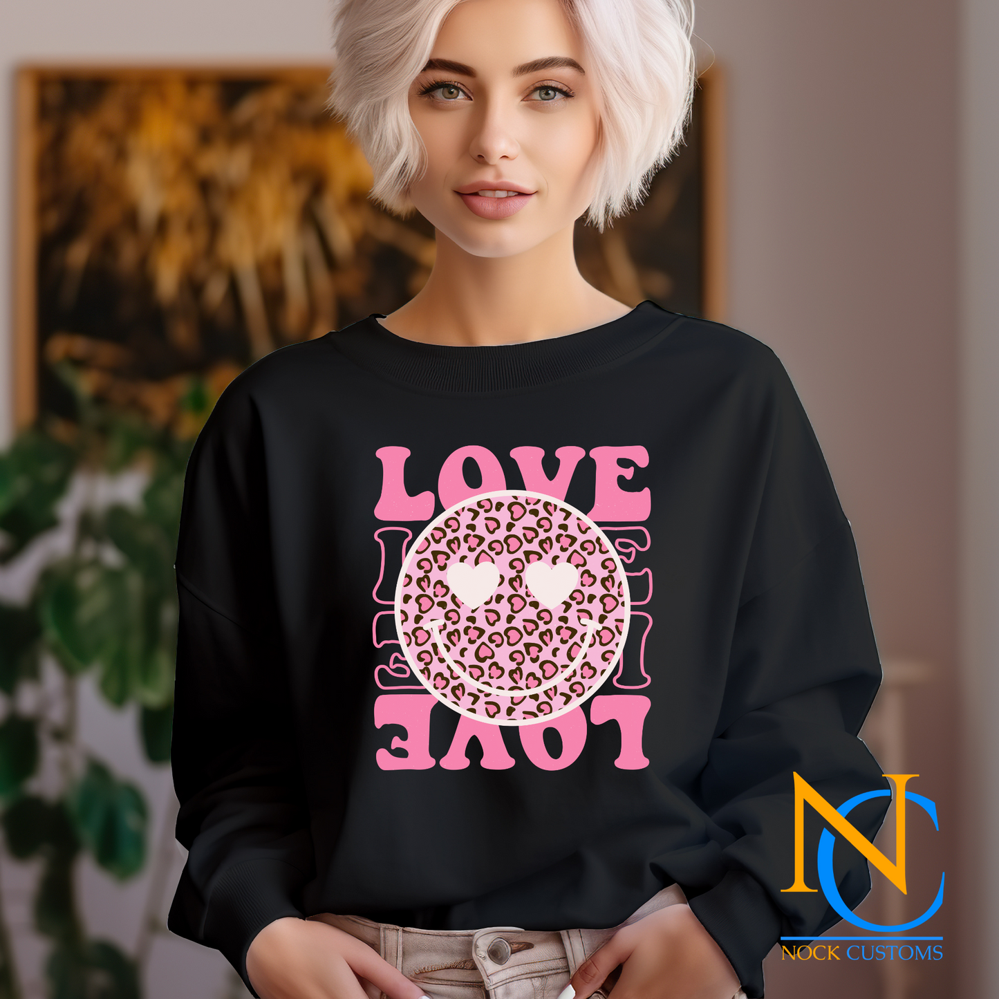 A vibrant pink design featuring a leopard print smiley face with heart eyes, surrounded by the word 'LOVE' in bold pink letters. Perfect for direct-to-film (DTF) transfers on various materials.