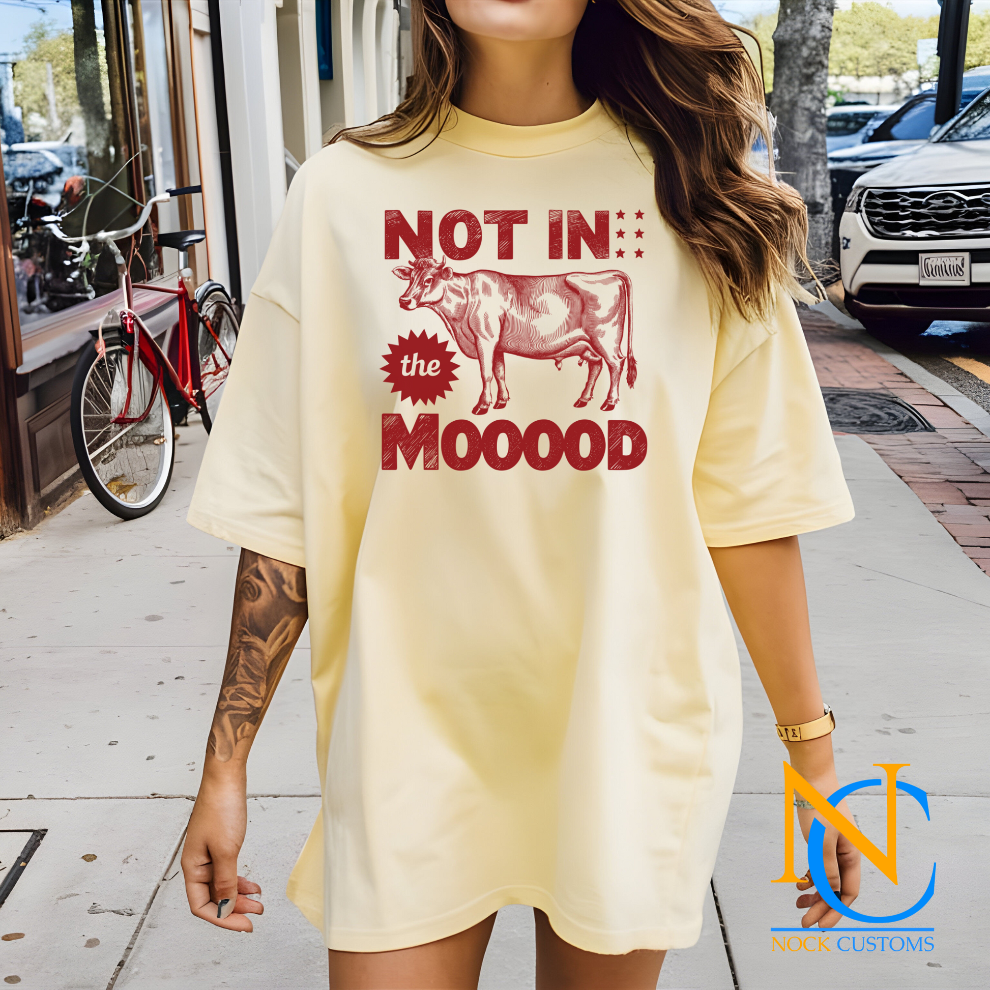 A humorous design featuring a red silhouette of a cow with bold text reading 'Not in the Mooood,' accented by star details. Perfect for direct-to-film (DTF) transfers with a playful and sarcastic vibe.