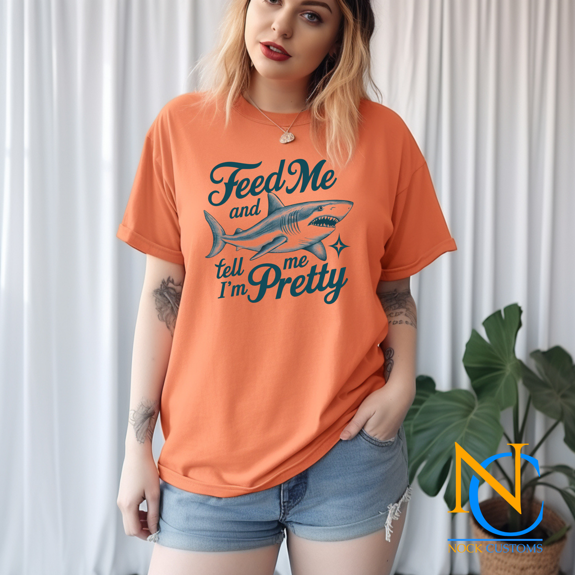 A playful design featuring a fierce shark with the humorous text 'Feed Me and Tell Me I'm Pretty,' complemented by a sparkling star accent. Perfect for direct-to-film (DTF) transfers with a fun and quirky vibe.