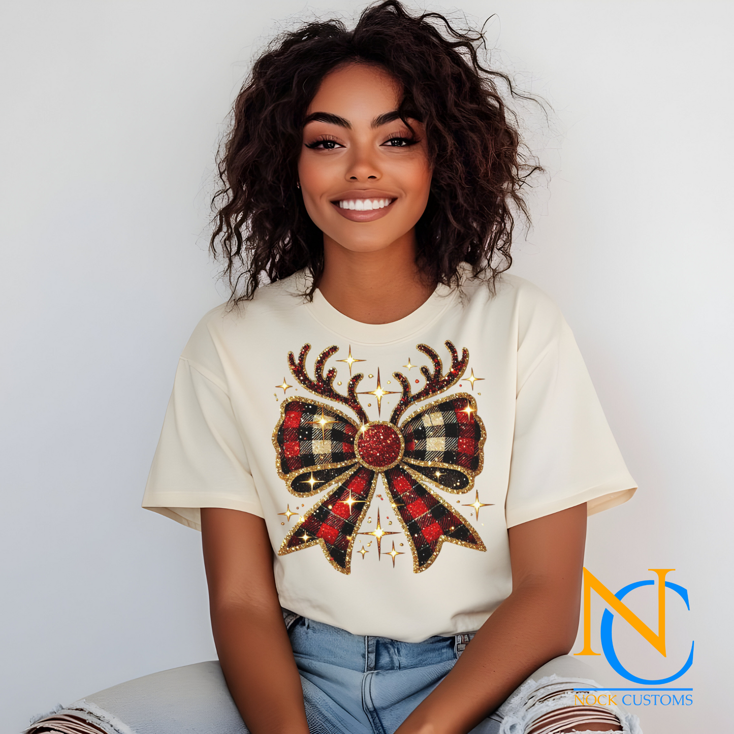 A festive plaid Christmas bow design with antlers and sparkling accents, ideal for holiday DTF transfers on apparel.