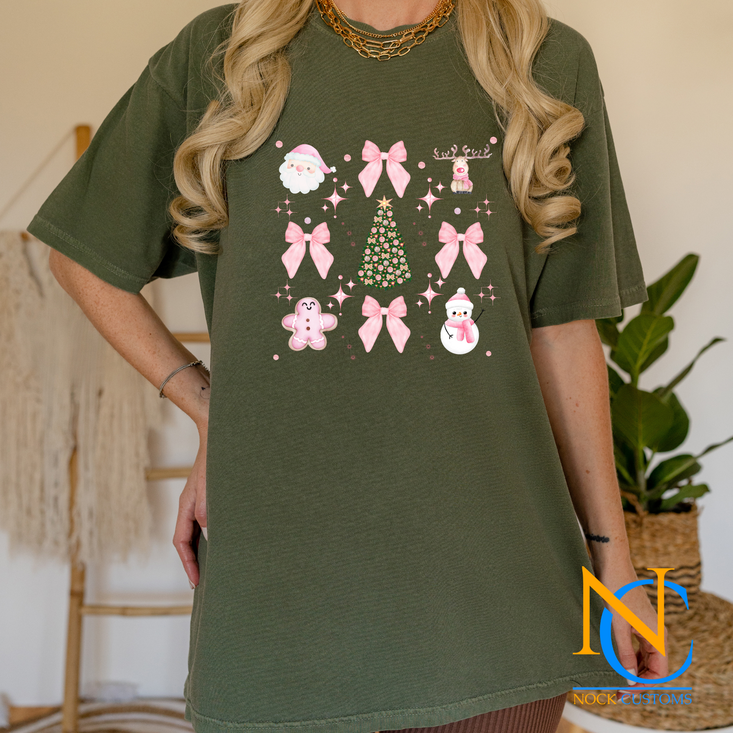 Festive pink-themed Christmas DTF transfer with bows, snowmen, gingerbread, and holiday tree designs for apparel decoration.