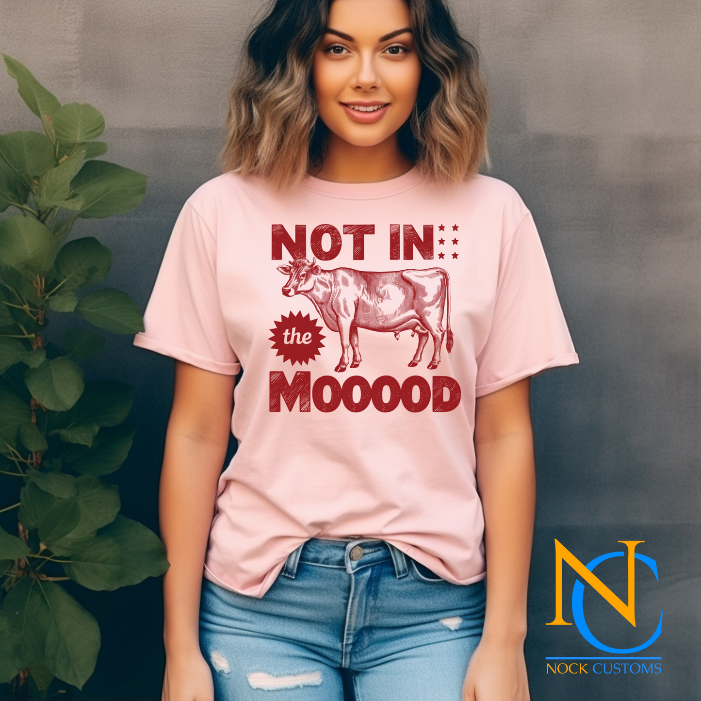 A humorous design featuring a red silhouette of a cow with bold text reading 'Not in the Mooood,' accented by star details. Perfect for direct-to-film (DTF) transfers with a playful and sarcastic vibe.