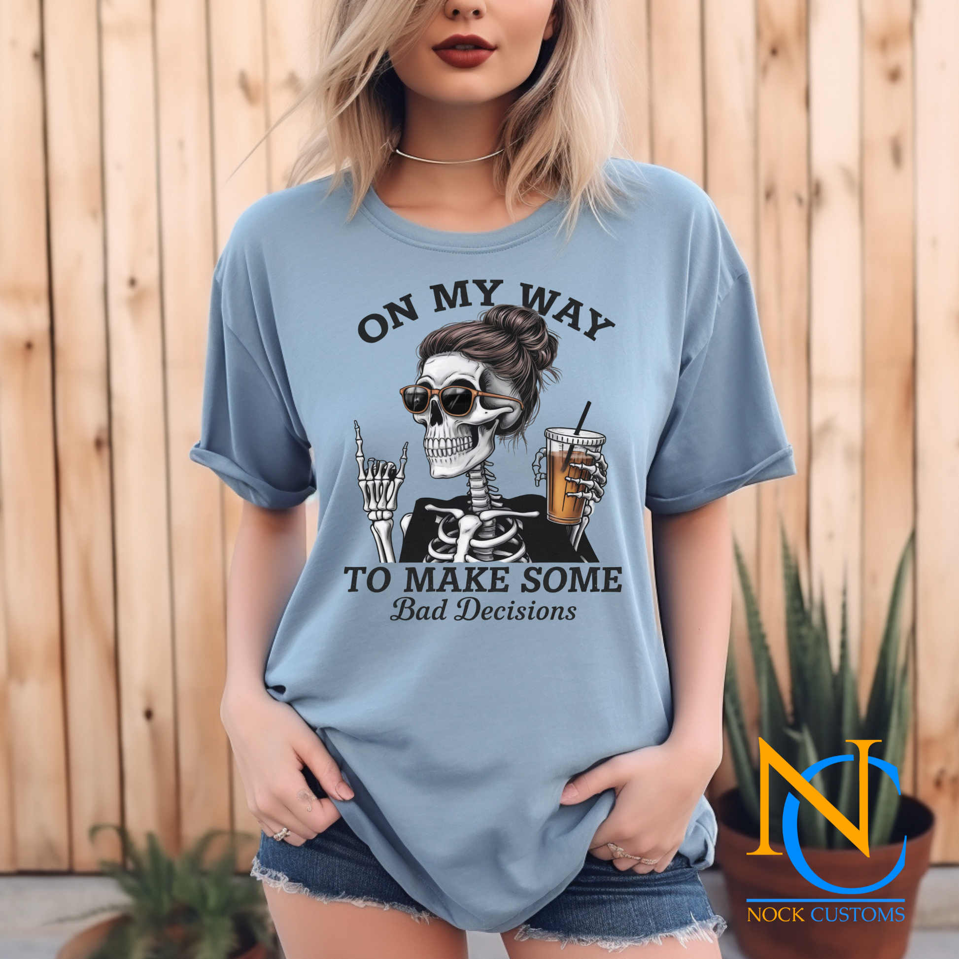 A fun and edgy design featuring a skeleton with a messy bun and sunglasses, holding an iced coffee, accompanied by the text 'On My Way to Make Some Bad Decisions.' Perfect for direct-to-film (DTF) transfers with a humorous and sassy vibe.